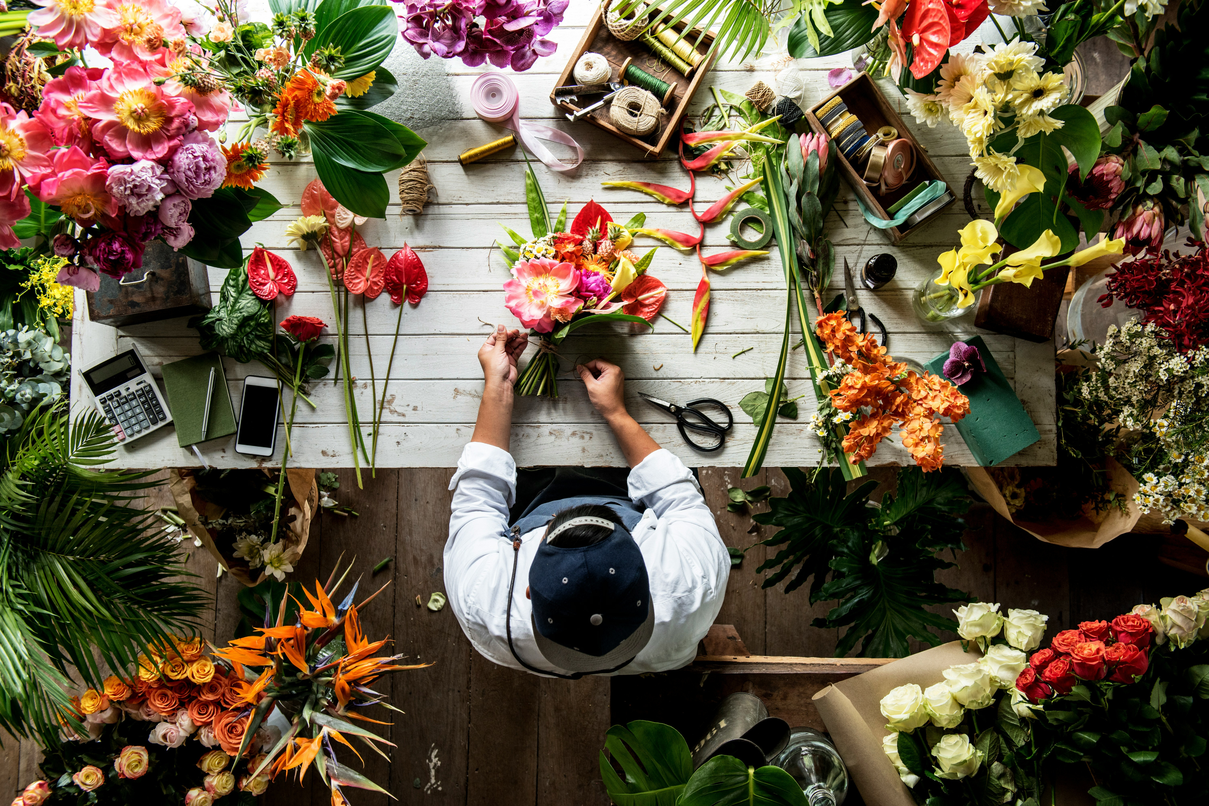 view-of-a-man-working-with-flowers-from-above